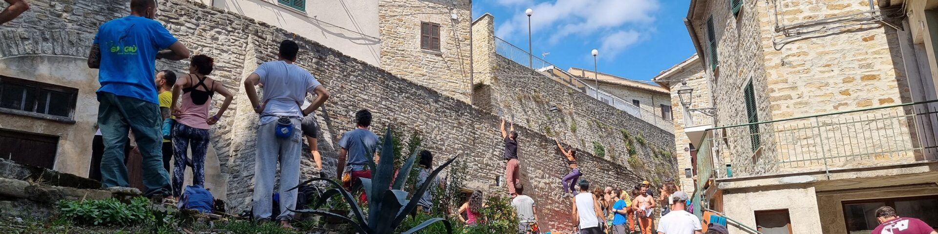 Urban buildering boulderig on the street Frasassi